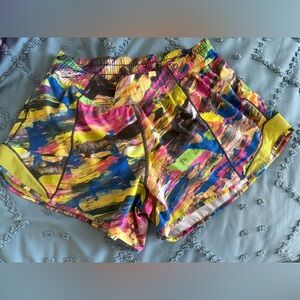 LULULEMON Hotty Hot Short 4” Tall catalyst size 10
Multi colored shorts